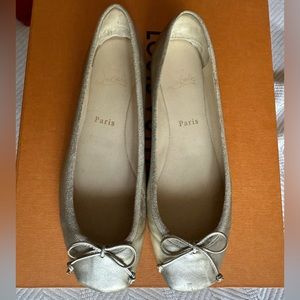 Christian Louboutin gold flats